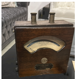 An antique wooden gauge enclosure repurposed as an Old-gauges display device.