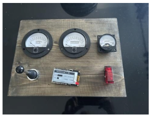 An ESP32-driven build with three analogue gauges mounted on a wooden board.